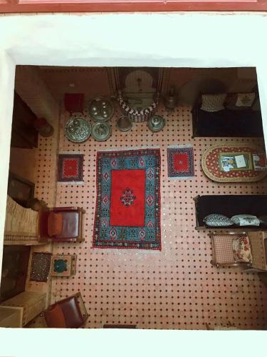 a toy table with many items on a tiled wall at Dar Pa Labzioui in Meknès