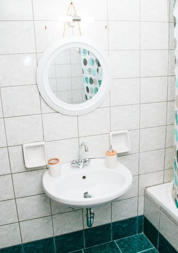 a bathroom with a sink and a mirror at Sette Isole Countryside Retreat Near Egremni Beach in Athanion