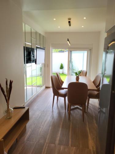 a dining room with a table and chairs at Guesthaus 2 in Dudelange
