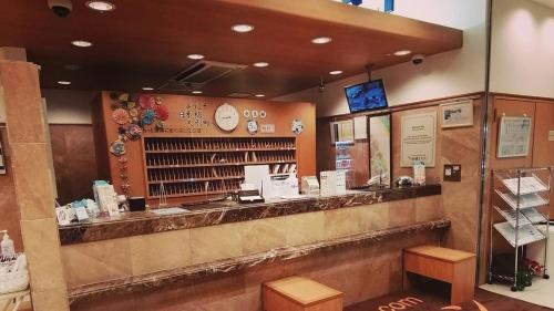 a bar in a restaurant with a counter at Toyoko Inn Tokyo Nihombashi Ningyocho in Tokyo