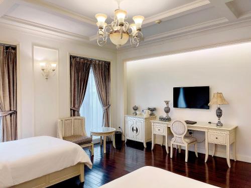 Giường trong phòng chung tại Eldora Hotel