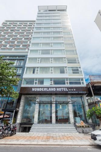 a tall building with a sign on the front of it at Nha Trang Wonderland Hotel in Nha Trang