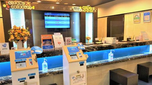 a store with a checkout counter in a mall at Toyoko Inn Tokyo Shinjuku gyoemmae eki 3 ban Deguchi in Tokyo