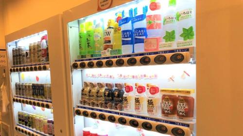 a refrigerator filled with lots of different types of drinks at Toyoko Inn Tokyo Shinjuku gyoemmae eki 3 ban Deguchi in Tokyo