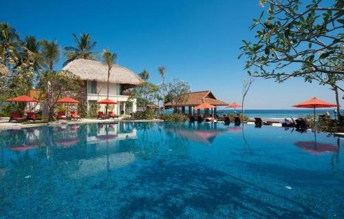 a swimming pool in front of a resort at Sudamala Resort, Senggigi, Lombok in Senggigi 