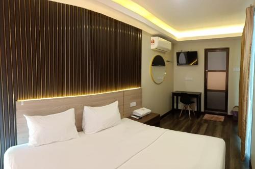 Tempat tidur dalam kamar di Tc theme park Guest house