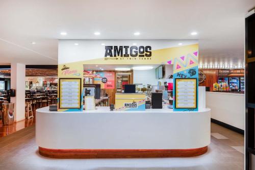 a restaurant with a counter in a store at The Sebel Twin Towns in Gold Coast