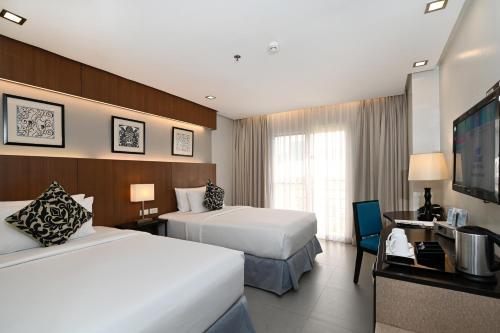 Postel nebo postele na pokoji v ubytování St Mark Hotel