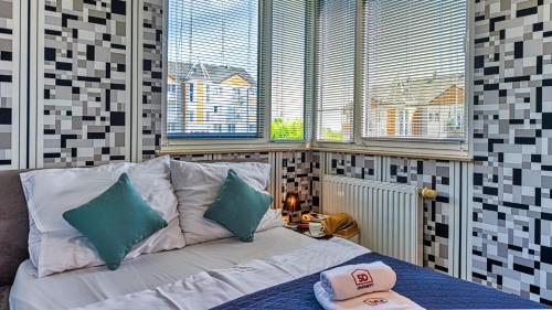 Posteľ alebo postele v izbe v ubytovaní Apartament Maki - 5D Apartamenty