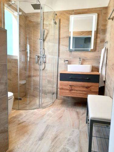 a bathroom with a sink and a shower at Lovely Rooms Rovinj in Rovinj