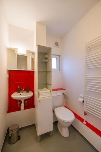 a bathroom with a toilet and a sink at La Port in Znojmo