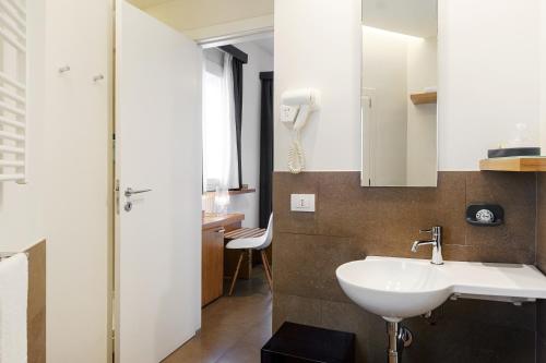 a bathroom with a sink and a shower at Iblaresort Boutique Hotel in Ragusa
