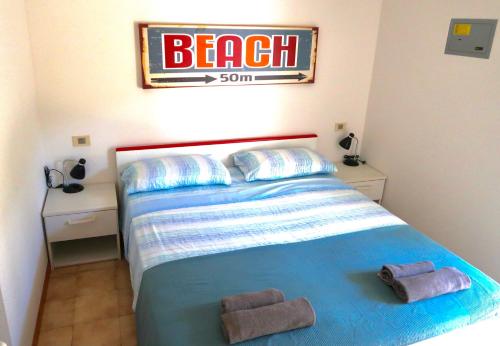 Cama o camas de una habitación en Grazioso Appartamento n 40 a Bibione a 100mt dal mare