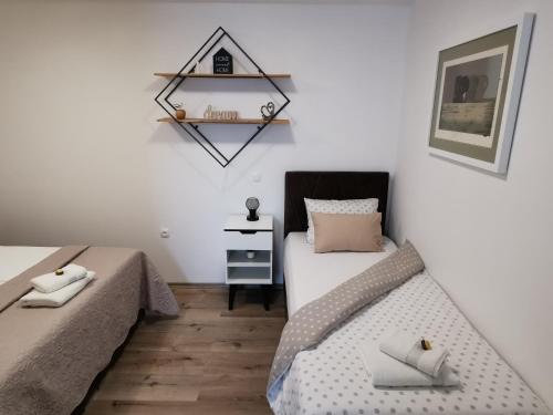 Ένα ή περισσότερα κρεβάτια σε δωμάτιο στο Apartments Alexandra
