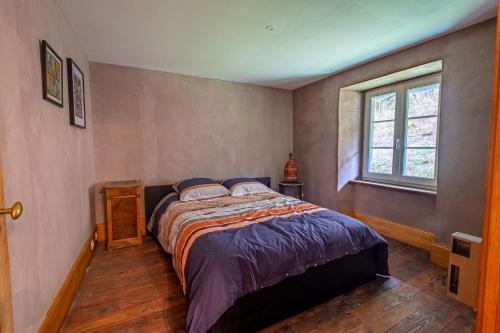 Posteľ alebo postele v izbe v ubytovaní La Demeure des Forges