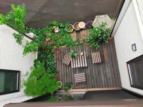an overhead view of a deck with plants and chairs at Deer hostel- - 外国人向け - 日本人予約不可 in Nara
