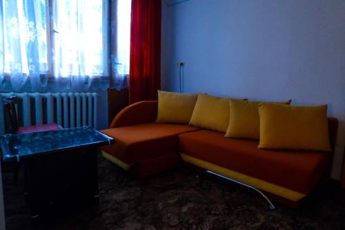 a living room with a couch and a window at Topuzovi Guest House in Dobrinishte