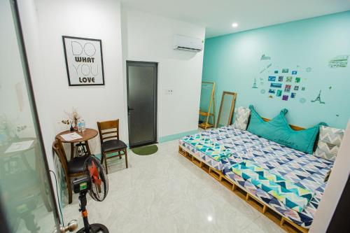 a bedroom with a bed and a wheelchair in it at 1984House in Quy Nhon