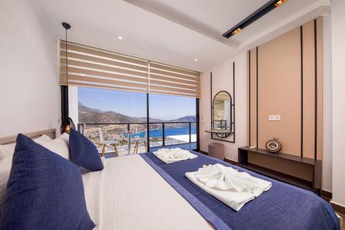 A bed or beds in a room at Luxury 5 bedroom villa with heated infinity pool & amazing sea views