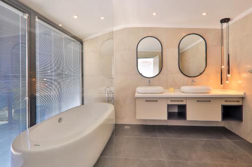 A bathroom at Luxury 5 bedroom villa with heated infinity pool & amazing sea views