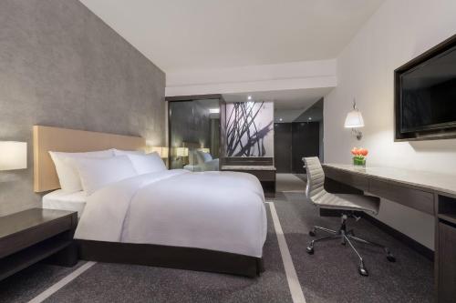 Un ou plusieurs lits dans un hébergement de l'établissement Gateway Hotel, Marco Polo