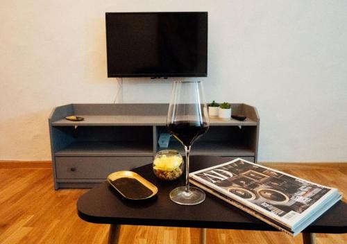 En tv och/eller ett underhållningssystem på Franz Haus Apartments