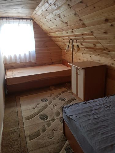 Ліжко або ліжка в номері Domek na uboczu