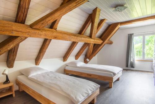 Кровать или кровати в номере La Ferme du Bonheur - Chez l'Gaby