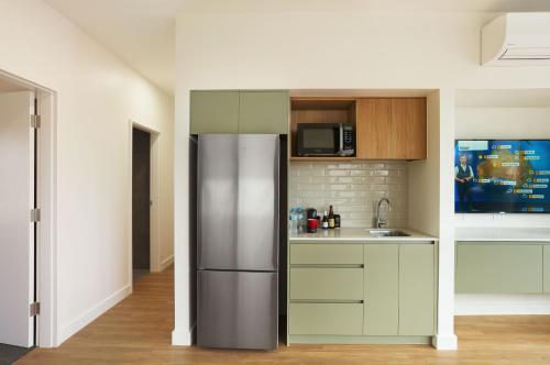 a kitchen with a stainless steel refrigerator at Berri Hotel in Berri