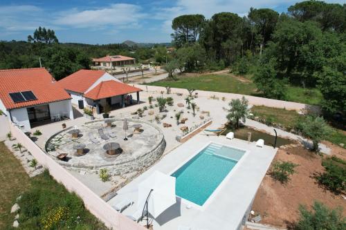an aerial view of a house with a swimming pool at Casas da Ladeia - Villa 1 in Alvorge