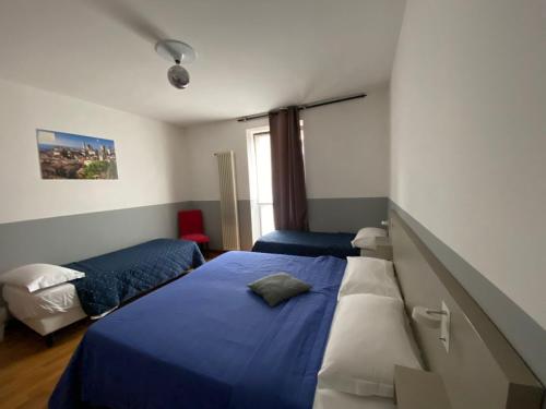 Posteľ alebo postele v izbe v ubytovaní Apartment Nido Stazione