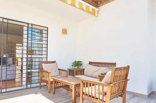 a living room with a couch and chairs and a table at Relax, Family, Telecommuting & Private Pool in Vélez-Málaga