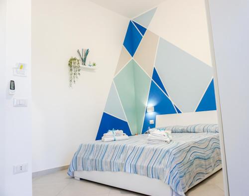 Ένα ή περισσότερα κρεβάτια σε δωμάτιο στο In Centro rooms