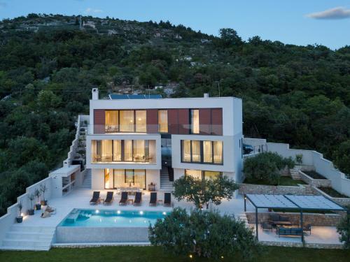 an aerial view of a house with a swimming pool at Luxury Villa Ó - Dubrovnik in Orasac