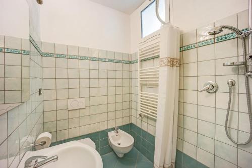 a bathroom with a shower and a sink and a toilet at Casa Paola e del Poeta in Costa Carnara