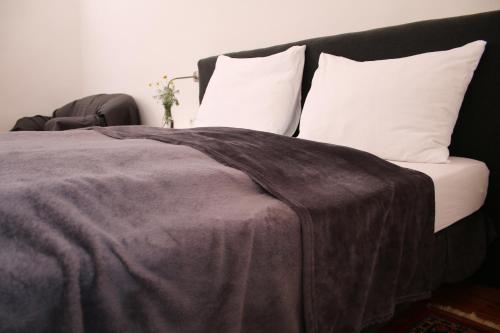 Ein Bett oder Betten in einem Zimmer der Unterkunft Hotel im Stift Neuberg