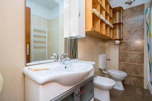 a bathroom with a sink and a toilet at Apartment Jakovac in Njivice