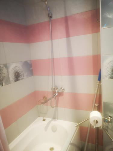 a bathroom with a shower and a tub and a sink at Complex Karia II in Kavarna