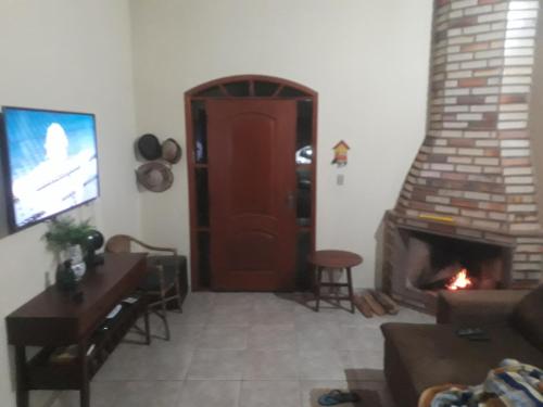 Casa das Floresにあるテレビまたはエンターテインメントセンター
