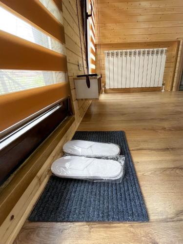 two pillows sitting on the floor of a room at Magic Box in Constanţa