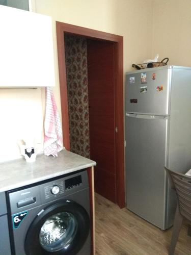 Η κουζίνα ή μικρή κουζίνα στο Sunny Aura apartment