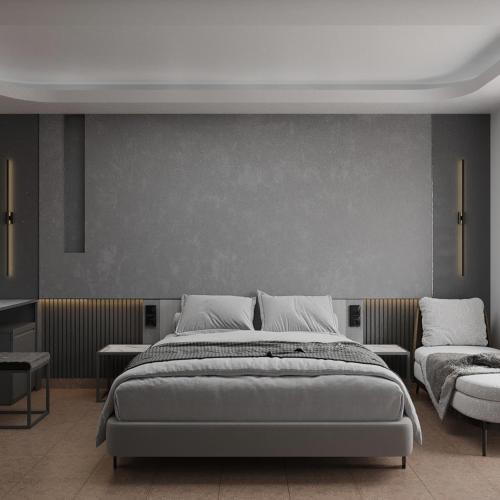 a bedroom with a large bed and a couch at Medi Otel in Samsun