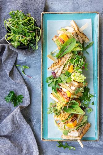 a blue plate of food with fish and vegetables at Radisson Blu Hotel Wroclaw in Wrocław