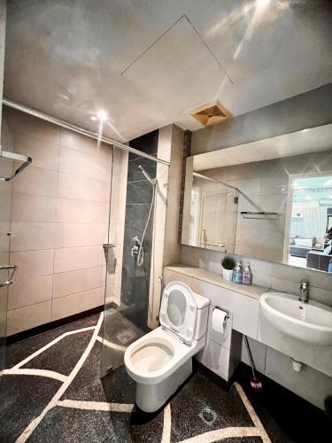 a bathroom with a toilet and a sink at Deco Home @ Imago The Loft in Kota Kinabalu