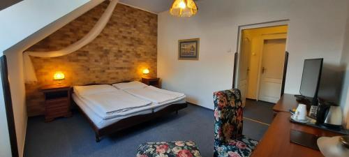 Кровать или кровати в номере Hotel Excellent