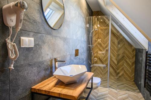 a bathroom with a sink and a shower at Maryna Bór in Zakopane