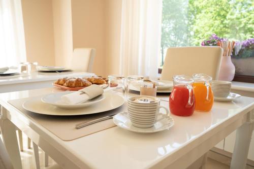 a table with breakfast foods and drinks on it at Il Castellaccio in Spello
