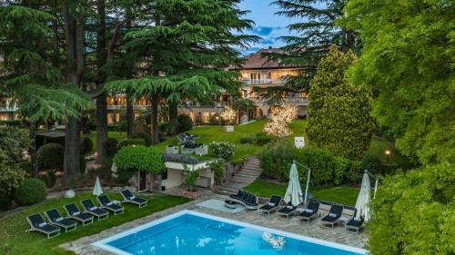 an aerial view of a house with a swimming pool and a yard at Villa Eden a member of Leading Hotels of the World in Merano