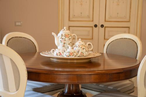 a table with a tea set on top of it at Il Castellaccio in Spello