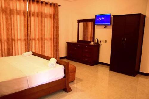 Voodi või voodid majutusasutuse Serendib Village Guest House toas